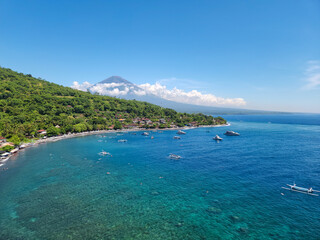 The picturesque Jemeluk Bay. View of the Agung volcano, the coast, the sea and the mountains. Amed, Bali Island, Indonesia