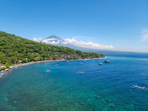 The picturesque Jemeluk Bay. View of the Agung volcano, the coast, the sea and the mountains. Amed, Bali Island, Indonesia