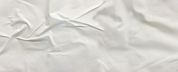 Background of white textured paper with crumples. Poster or sticker with pattern