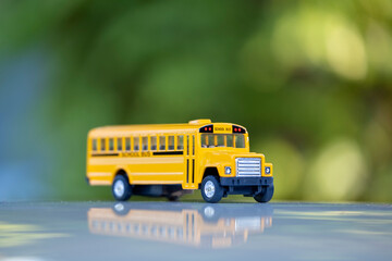 Small model of american yellow school bus as symbol of education in the USA © bilanol