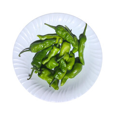Fresh green chili placed on a plate