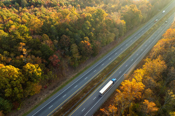 USA highway transportation infrastructure in North Carolina Appalachian mountains. American freeway road with fast driving semi trucks © bilanol