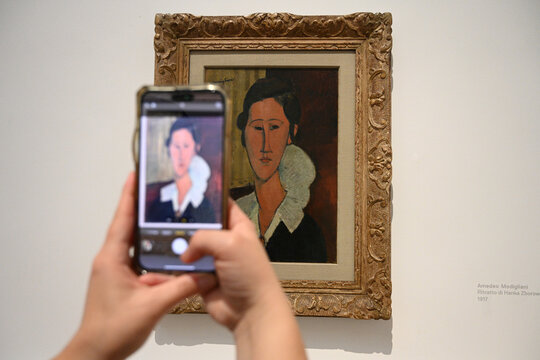 Rome, Italy - November 1, 2024: Visitors near the Amedeo Modigliani painting in National Gallery of Modern and Contemporary Art (La Galleria Nazionale) in Rome.