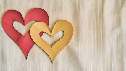 Fototapeta premium Two hearts next to each other on a light background. Symbol of harmony and unity, suitable for design of greeting cards, decorative elements, graphic materials on romantic themes