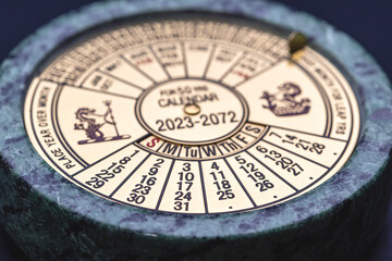 A studio macro shot for a theme of Equinox, with a studio shot of a perpetual calendar set into marble, focussed on the date of the Equinox, the 22 September 2024.