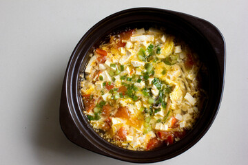 A delicious egg soup meal. Made with eggs and chopped tomatoes, it's perfect for lunch.