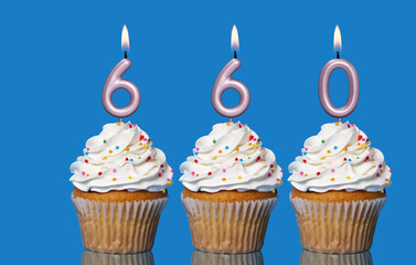 Birthday Cupcakes With Candles Lit Forming The Number 660