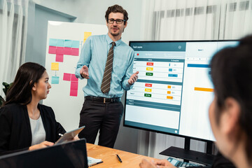 Project manager planning schedules for business task at meeting room, Gantt chart software show on...