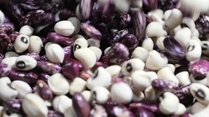 Beans cascading gracefully onto a rustic wooden table