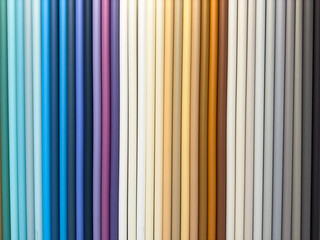 Obraz premium A row of colorful fabric swatches, including blue, purple, and white