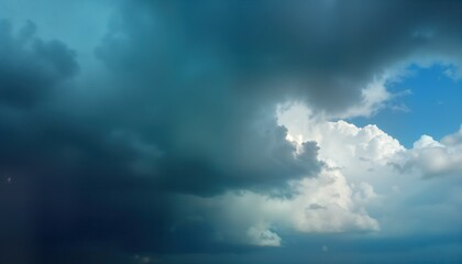 Obraz premium Dark, stormy sky with fluffy white clouds. Rain clouds are heavy and threatening. The sun shines through the clouds, illuminating the scene. Nature and weather are in full display.