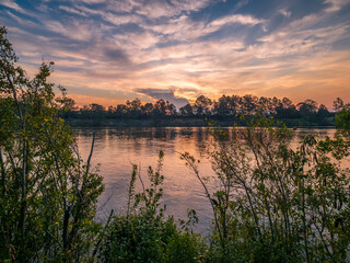 Naklejka premium Sunset Over The River