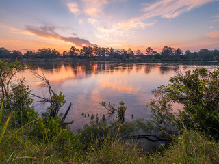 Obraz premium Sunset Over The River