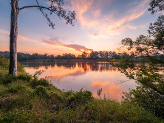 Obraz premium Sunset Over The River