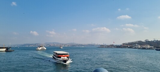 Obraz premium A view of the Bosporus Strait, where numerous ships and boats gently cross the water, connecting Europe and Asia