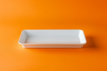 Chrome empty plate on orange background