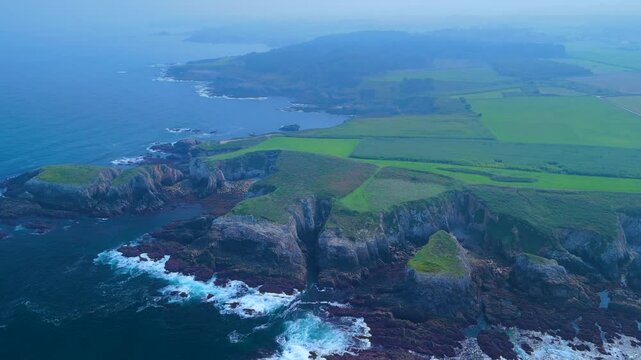 Aerial view from a drone of the coastal landscape and crops in the area around Cabo Cebes in Tapia de Casariego. Asturias. Spain. Europe