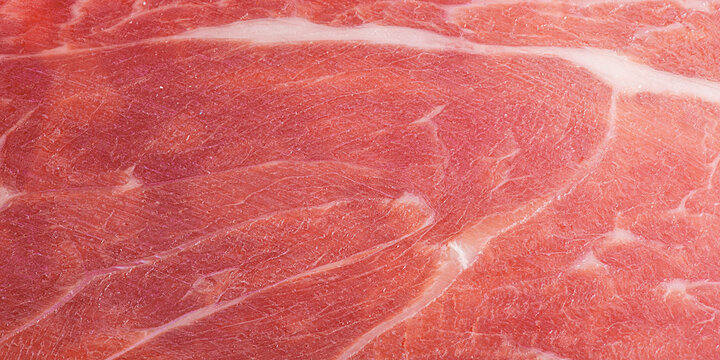 Hamon meat thin slice as macro photo background.