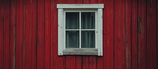 White window framed in rustic red wooden wall highlighting charming architectural details