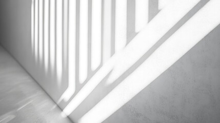 Fototapeta premium Diagonal shadows and light rays create a textured effect on a white wall providing a blurred overlay suitable for photos and mockups