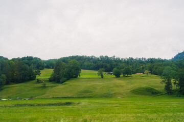 Obraz premium Scenic countryside view featuring traditional buildings surrounded by lush greenery in a tranquil rural setting Konigssee Bavaria German Apls. High quality photo