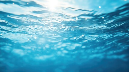 Fototapeta premium Vibrant blue water surface featuring gentle ripples and bubbles Vertical orientation showcasing a natural backdrop