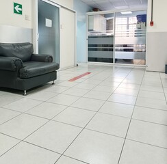 Hospital Waiting Room with Black Leather Chair. Medical concept