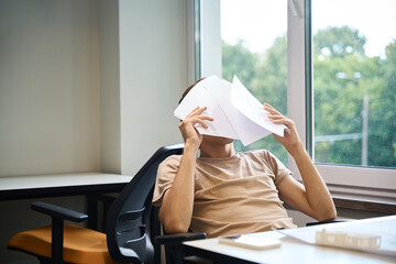 Young man is resting at work