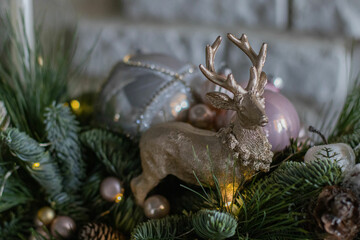 Christmas gold Deer figure. Home decoration, nobilis, pine needles Christmas composition with beautiful decoration. Festive Decor, Christmas Decor.