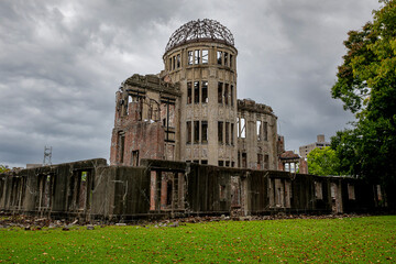 Atomic Bomb Dome memorial building in Hiroshima under a cloudy day