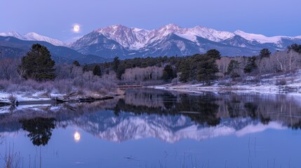 Serene Landscape with Full Moon Over Snowy Mountain Range and Tranquil Lake Reflection at Dusk in Colorado, USA