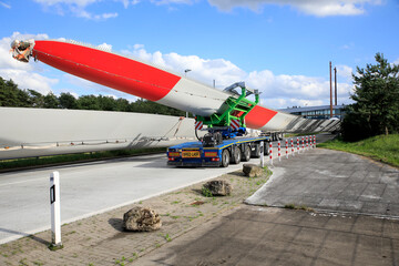 Fototapeta premium Transportation of a wind turbine blade by truck in Germany