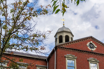 A view of Harvard Hall and its cupola at Harvard University on an autumn day in Cambridge,...