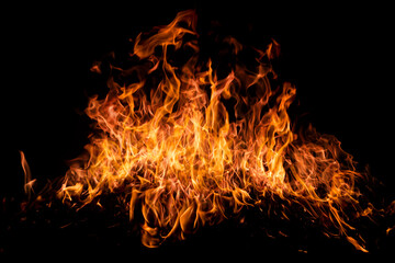 Fire sparks background. Abstract blaze flames background. Burning fire. Texture of fire on a black...