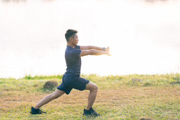 Man jogging in the park Man running on a sunny day Smile and have fun with outdoor activities, motivation, fitness, exercise. and male runners in exercise