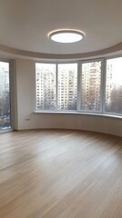Obraz premium Bright and spacious empty apartment with large windows in a modern building during the daytime