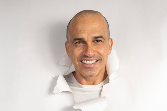 48 year old Brazilian man in casual clothes, only his head on a torn cardboard, showing emotions_2.