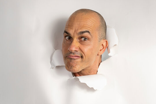 48 year old Brazilian man in casual clothes, only his head on a torn cardboard, showing emotions_5.