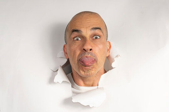 48 year old Brazilian man in casual clothes, only his head on a torn cardboard, showing emotions_11.