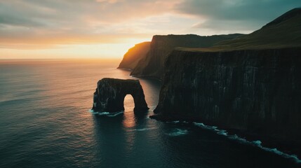 A breathtaking aerial perspective of rugged sea cliffs and natural arches along the dramatic coastline of Australia at sunrise, Australian coastal cliffs scene, Cinematic style