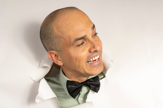 48 year old man in casual clothing and a bow tie, with only his head on a cardboard, showing emotions_5.