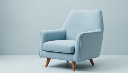 Fototapeta premium modern light blue armchair with wooden legs in a minimalistic interior design