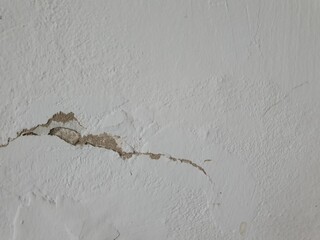 Crack white wall texture background.