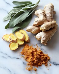 fresh ginger and cinnamon on a marble surface Fresh ginger and turmeric with sage leaves.
