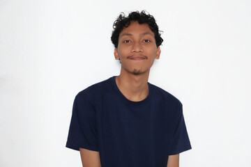 The smiling man is wearing a dark blue T-shirt.