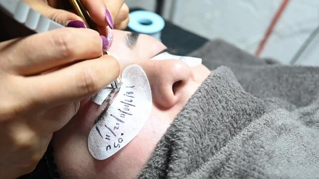 Detail of placing artificial eyelashes