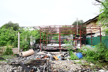 BANGKOK, THAILAND - November 15, 2024: Debris from a house after a fire caused by an electrical...
