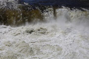 The threshold of the waterfall. The rushing water.