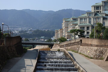 Japanese city landscape blue sky, bridges, trees, electric cable gardens, and beautiful city layout