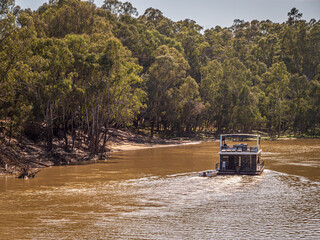 Open Houseboat Towing Dinghy Upstream